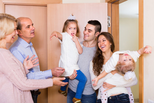 Aged Couple Meeting Family At Doorstep