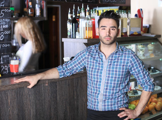 Small business owner working at his cafe