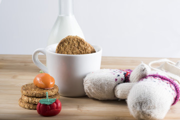 Breakfast with fresh milk, biscuits and candy