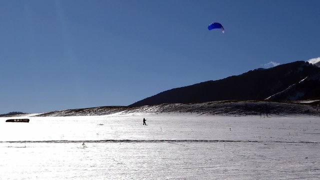  Snowkiting lessons in a snow-covered valley of Roccaraso, Italy