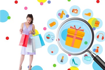 Stylish brunette opening shopping bag