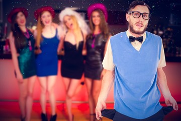 Composite image of geeky hipster showing empty pockets