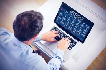 Fototapeta na wymiar Composite image of man using laptop