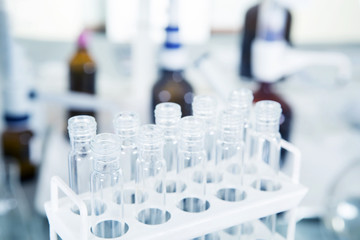 Laboratory equipment, glass tubes in laboratory interior.