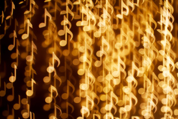 Blurring lights bokeh background of music notes