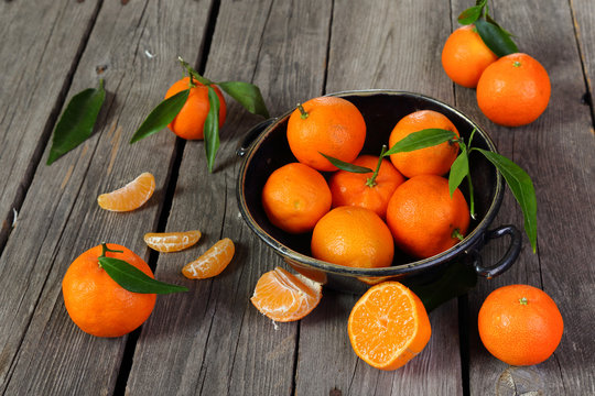 Tangerines  on a black wooden table