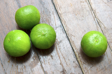 Lime green with a wooden floor in the background.
