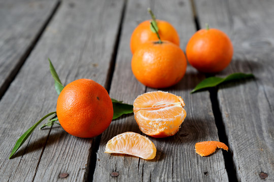 Tangerines on the gray wooden table