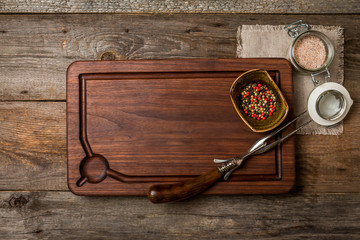 Cutting board, seasonings and meat fork