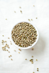 hemp seeds on wooden surface