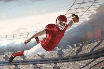 Composite image of american football player scoring a touchdown - obrazy, fototapety, plakaty