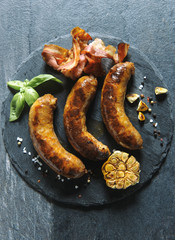 Fried domestic bacon and sausages