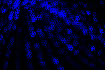 Blue snowflakes bokeh blur lights. Winter holidays lights.