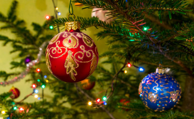 Beautiful colorful christmas decorations hanging on christmas tr