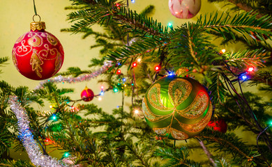 Beautiful colorful christmas decorations hanging on christmas tr