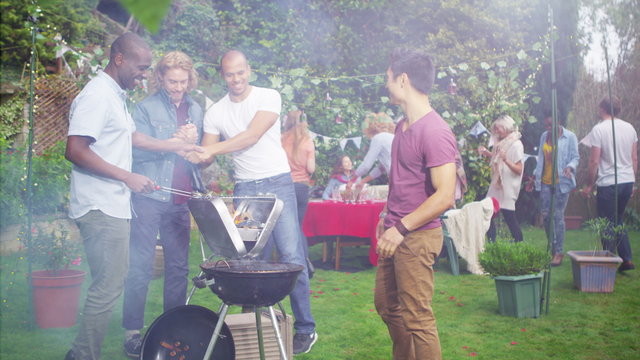 Happy group of friends having fun at outdoor bbq