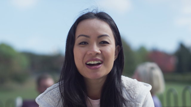  Happy young woman having a video chat, as seen from the computer screen's pov