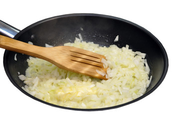 Onion frying in a pan isolated
