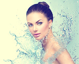 Beautiful model spa woman with splashes of water