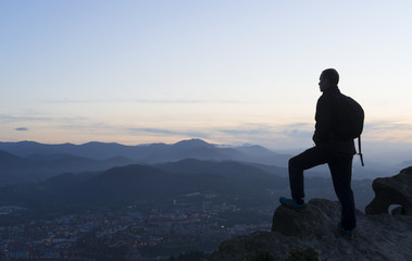 man looking at the landscape at sunset, Basque Country