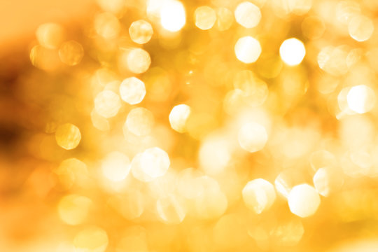 the Abstract blur golden bokeh lighting for holiday background 
