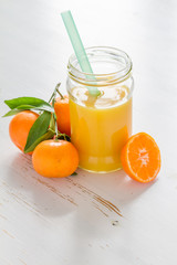 Mandarin juice in glass jar