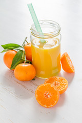 Mandarin juice in glass jar