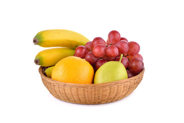 mixed fruit, banana, orange, pear, grape in basket on white back