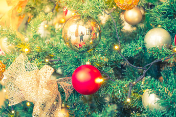 Fototapeta na wymiar Closeup of Christmas tree decorations background ( Filtered imag