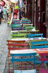 Fototapeta na wymiar Paris - Very colorful Parisian outdoor cafe in Montmartre