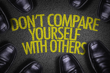 Top View of Business Shoes on the floor with the text: Don't Compare Yourself With Others