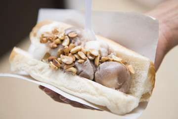 ice cream with bread in hand hold