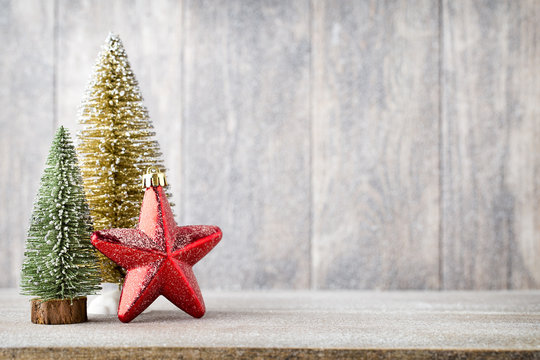 Christmas fir branch and decor, on the wooden background.