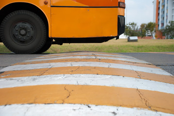 The speed bumps on the road and the bus
