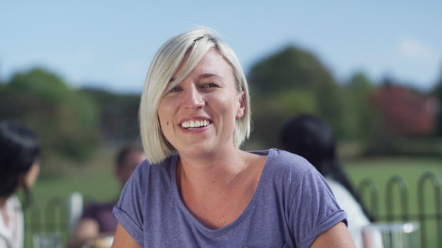  Happy young woman having a video chat, as seen from the computer screen's pov