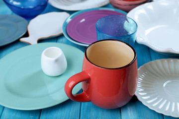 Different tableware on wooden table close up