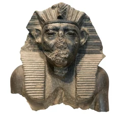  Head of an ancient egyptian pharaoh carved in black stone © kmiragaya