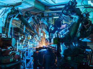 Welding robots movement in a car factory