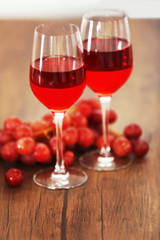 Two wineglasses with grape on the table, close-up