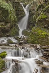 wonderful view of Leshnishki Waterfall in deep forest, Belasitsa Mountain, Bulgaria