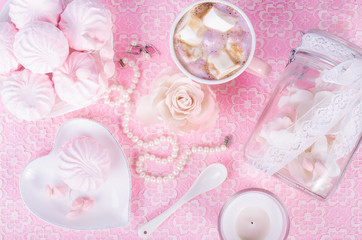 Cute set of pink princess accessories and sweets. Bottle with mastic flowers, big peach rose,...
