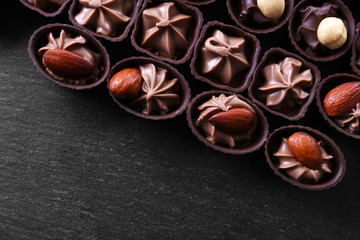 Chocolate sweets on wooden background