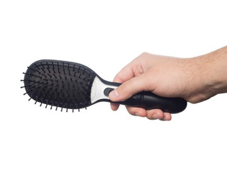 Obraz premium Electronic massage black comb in hand