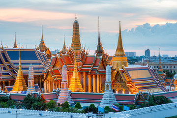 Fototapeta premium The beauty of the Emerald Buddha Temple at twilight. And while the gold of the temple catching the light. This is an important buddhist temple of thailand and a famous tourist destination.
