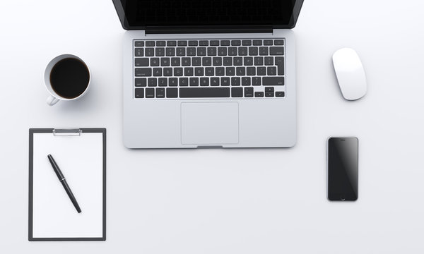 workplace with laptop, smartphone, coffee, notepad