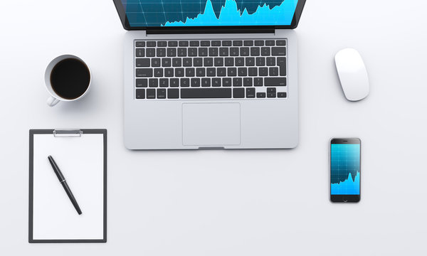 workplace with laptop, smartphone, coffee, notepad