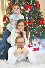 Fototapeta na wymiar Christmas family portrait in home holiday living room