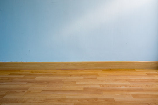 wood floor and light blue wall for background