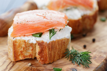 small sandwiches with soft cheese and salmon