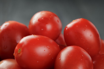 red cherry or plum tomatoes in bowl